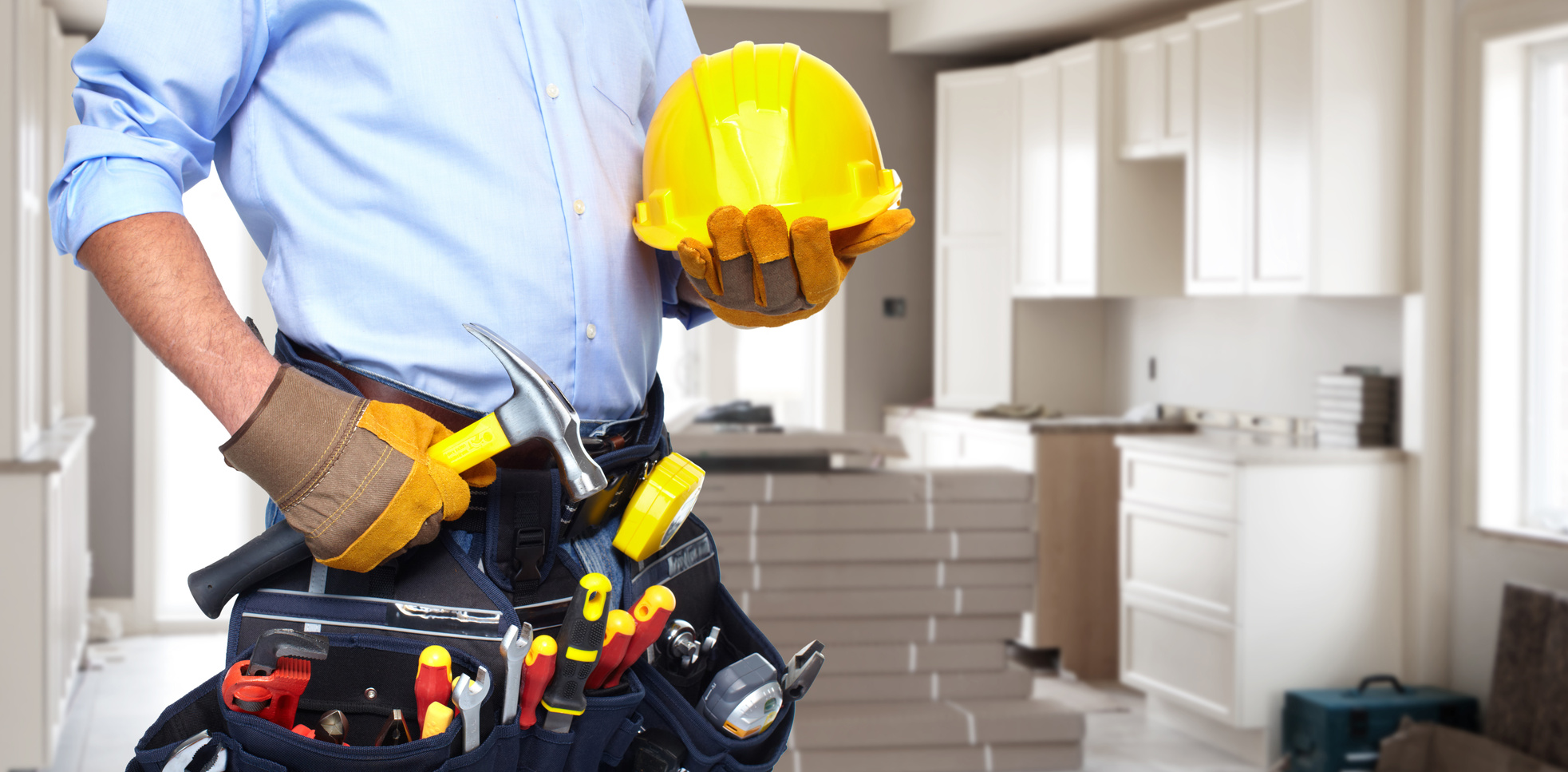 Handyman with a tool belt. House renovation service.